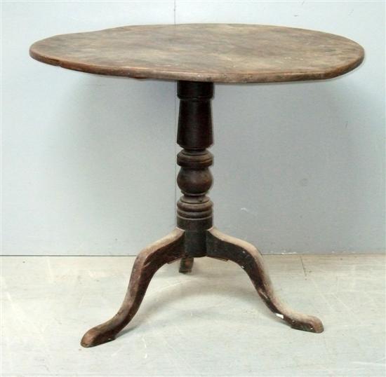 Appraisal: George III mahogany round table on turned column support and