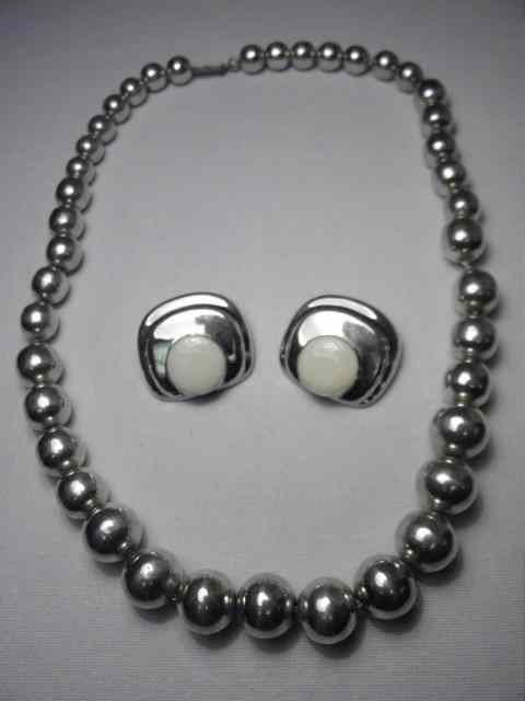 Appraisal: Sterling silver necklace of large graduated beads on sterling silver