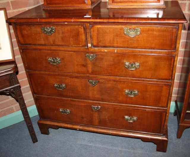 Appraisal: A GEORGE III WALNUT CHEST the burr walnut butterfly crossbanded