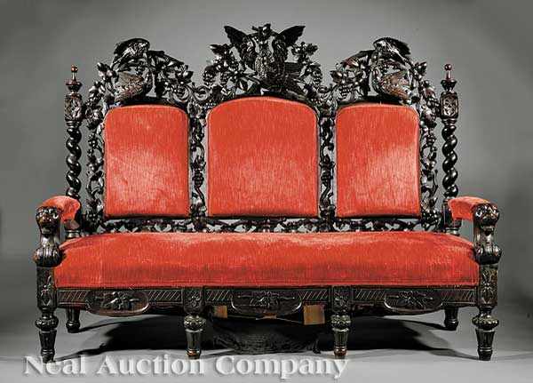 Appraisal: A Continental Carved Walnut Sofa th c tripartite back crested