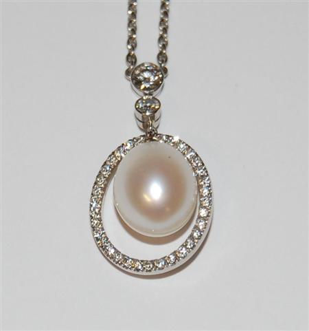 Appraisal: A modern large cultured pearl and diamond set necklace collet