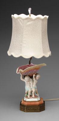 Appraisal: Ceramic lamp with putti and shell three putti holding large