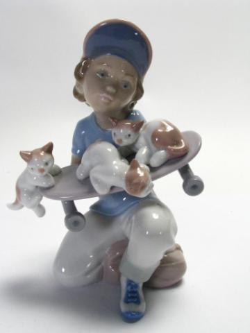 Appraisal: Lladro Little Riders Figurine depicting boy with kittens on skateboard