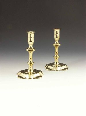 Appraisal: A pair of mid th century brass candlesticks with knopped