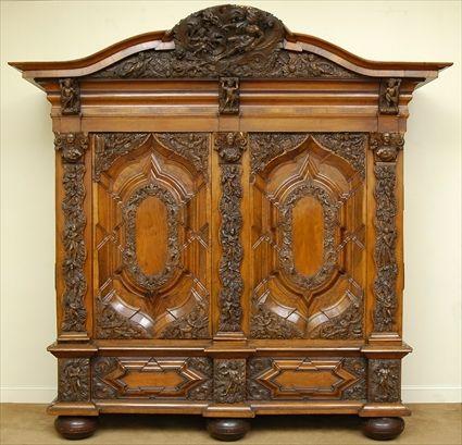 Appraisal: NORTH EUROPEAN BAROQUE CARVED AND VENEERED WALNUT SHRANK The serpentine