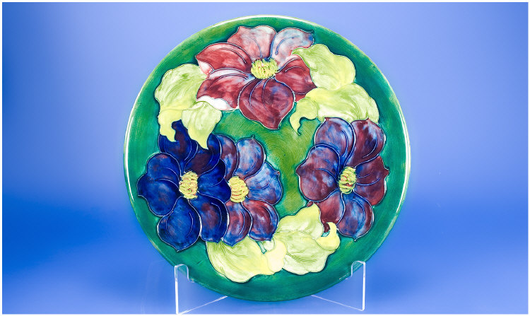 Appraisal: Moorcroft Charger Decorated In The Clematis Range On A Green