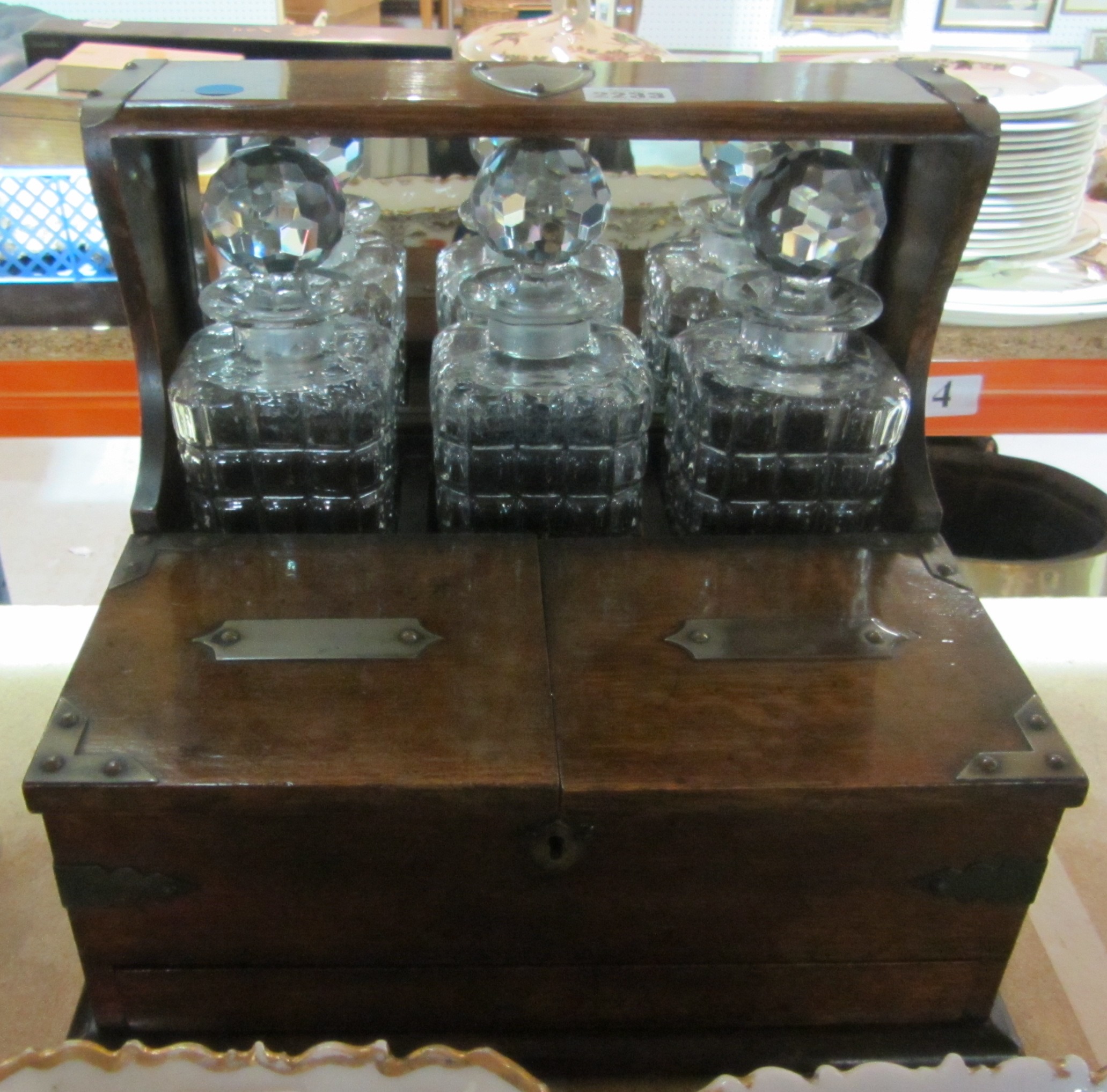 Appraisal: A th century oak tantalus with integral cigar box and