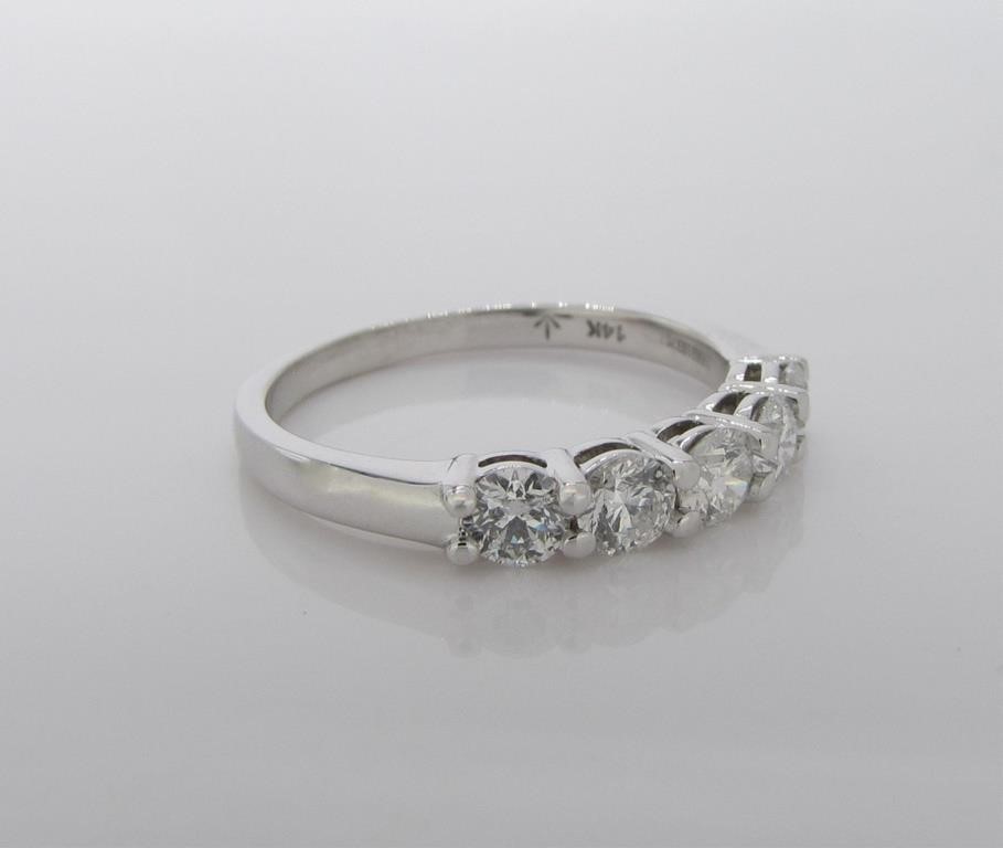 Appraisal: A K white gold diamond band ring each diamond of