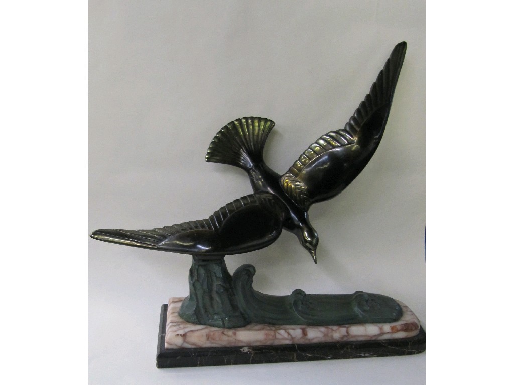 Appraisal: Art Deco style sculpture of a bird in flight mounted