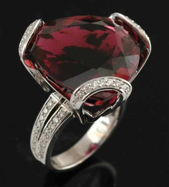 Appraisal: A tourmaline and diamond dress ring The centrally set triangular