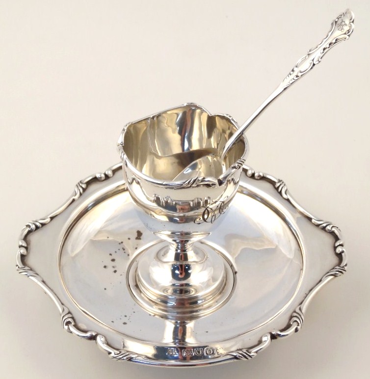 Appraisal: An Edwardian silver egg cup on stand cm wide with