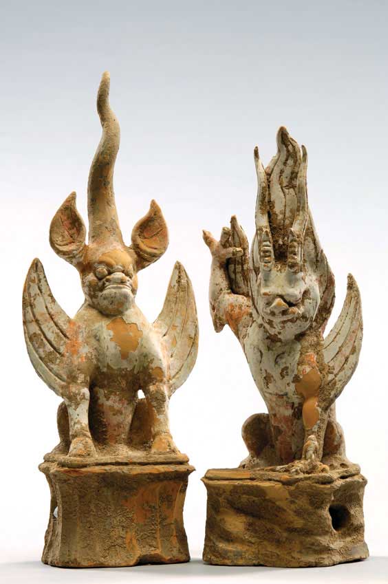 Appraisal: PAIR TANG POTTERY EARTH SPIRITS Pair of well modeled Chinese