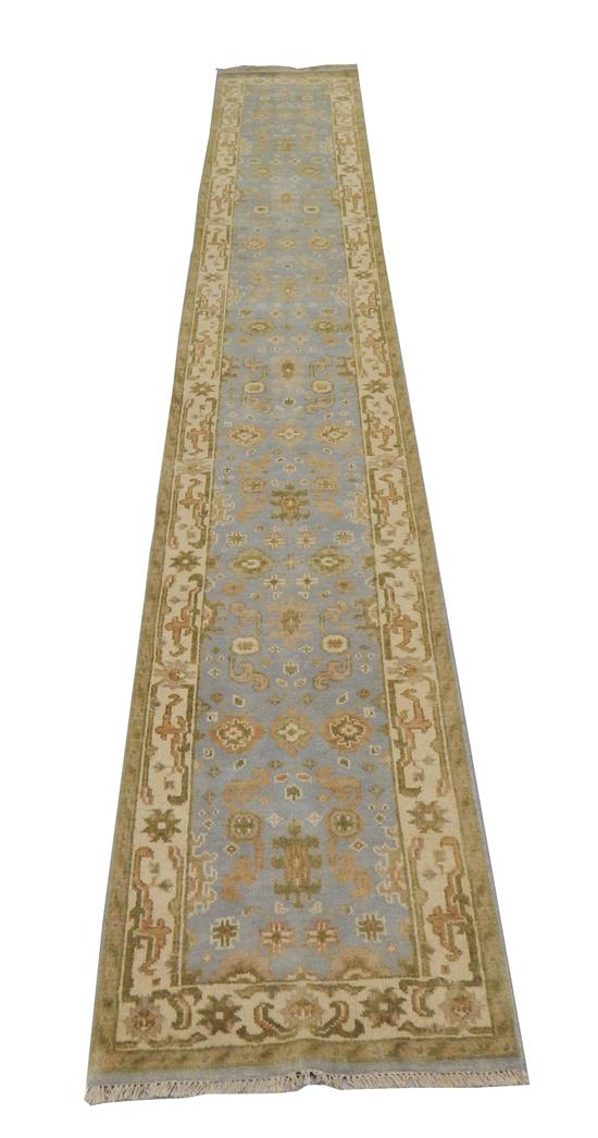 Appraisal: RUG Oushak runner '' x '' powder blue field with