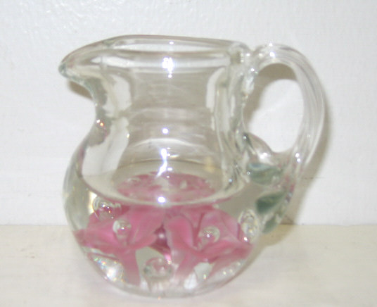 Appraisal: PAPERWEIGHT HANDLED JUG With pink floral design Height inches Estimate