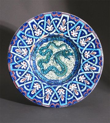 Appraisal: A William De Morgan Persian earthenware charger painted with a