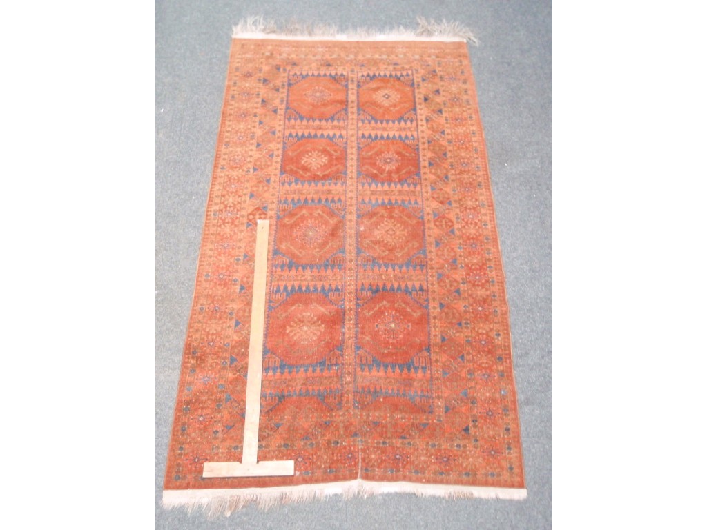 Appraisal: An eight panel medallion multi-border rug cm x cm