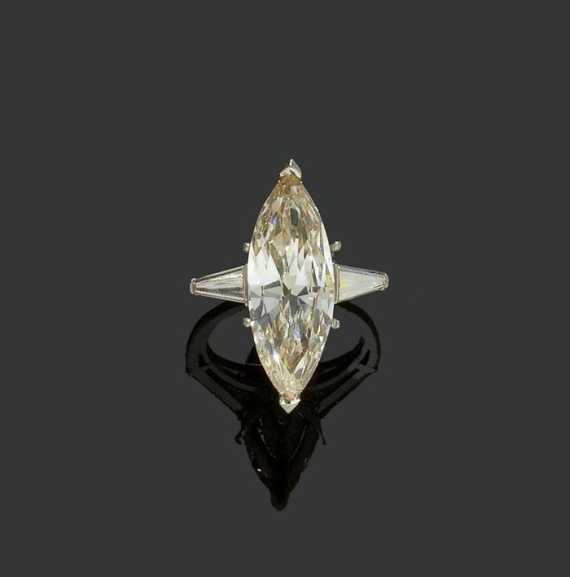 Appraisal: DIAMOND RING ca Platinum iridium Classic-elegant solitaire model the top