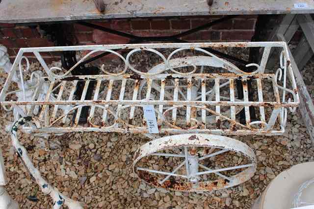 Appraisal: AN OLD WROUGHT IRON WHITE PAINTED PLANTER with large wheels