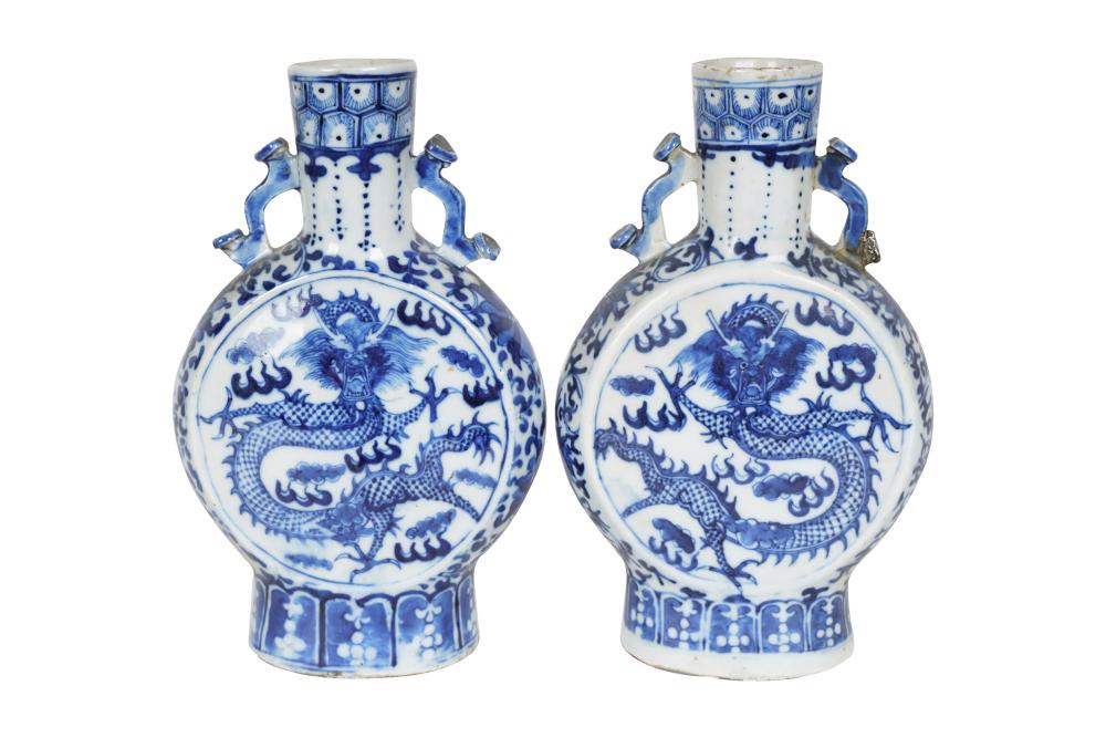 Appraisal: PAIR OF BLUE WHITE CHINESE VASESdepicting dragons Condition with repair