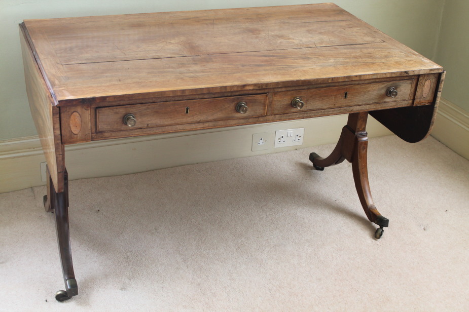 Appraisal: A Regency mahogany sofa table with frieze drawers drop ends