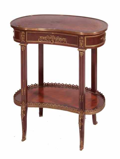 Appraisal: A CONTINENTAL MAHOGANY KIDNEY SHAPED SIDE TABLE with under gallery