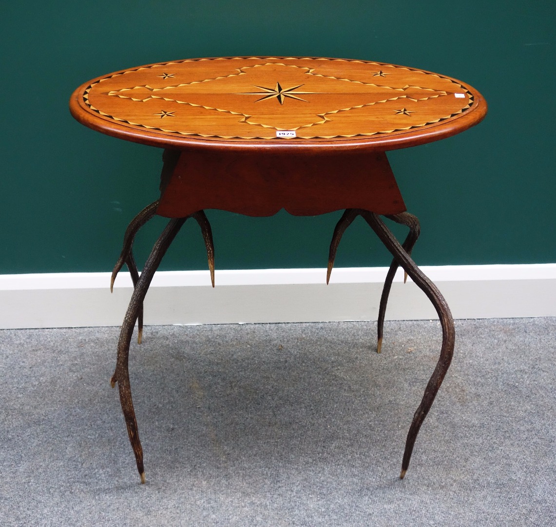 Appraisal: An Anglo-Indian inlaid oval occasional table on a pair of