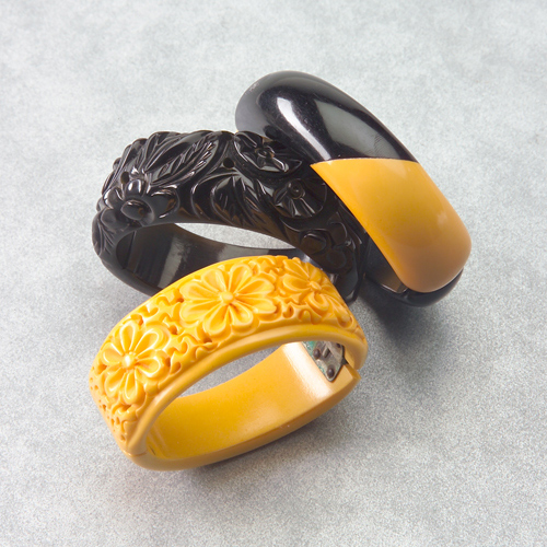 Appraisal: Three Bakelite clamper bracelets black and tan spiral laminate incised