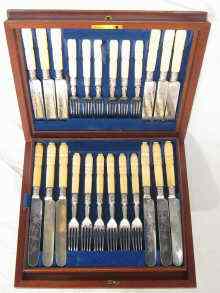 Appraisal: A set of silver plated fruit knives and forks with