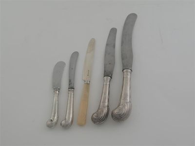 Appraisal: A set of George II table knives with leaf-capped pistol