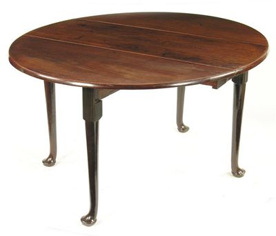 Appraisal: A mid th century mahogany drop leaf table the oval