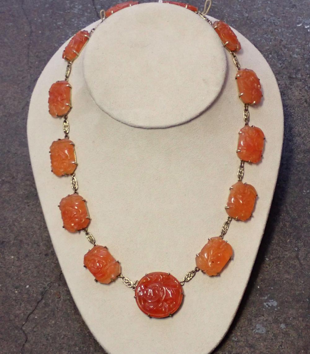 Appraisal: ANTIQUE ORANGE JADE AND FOURTEEN KARAT GOLD NECKLACE The -