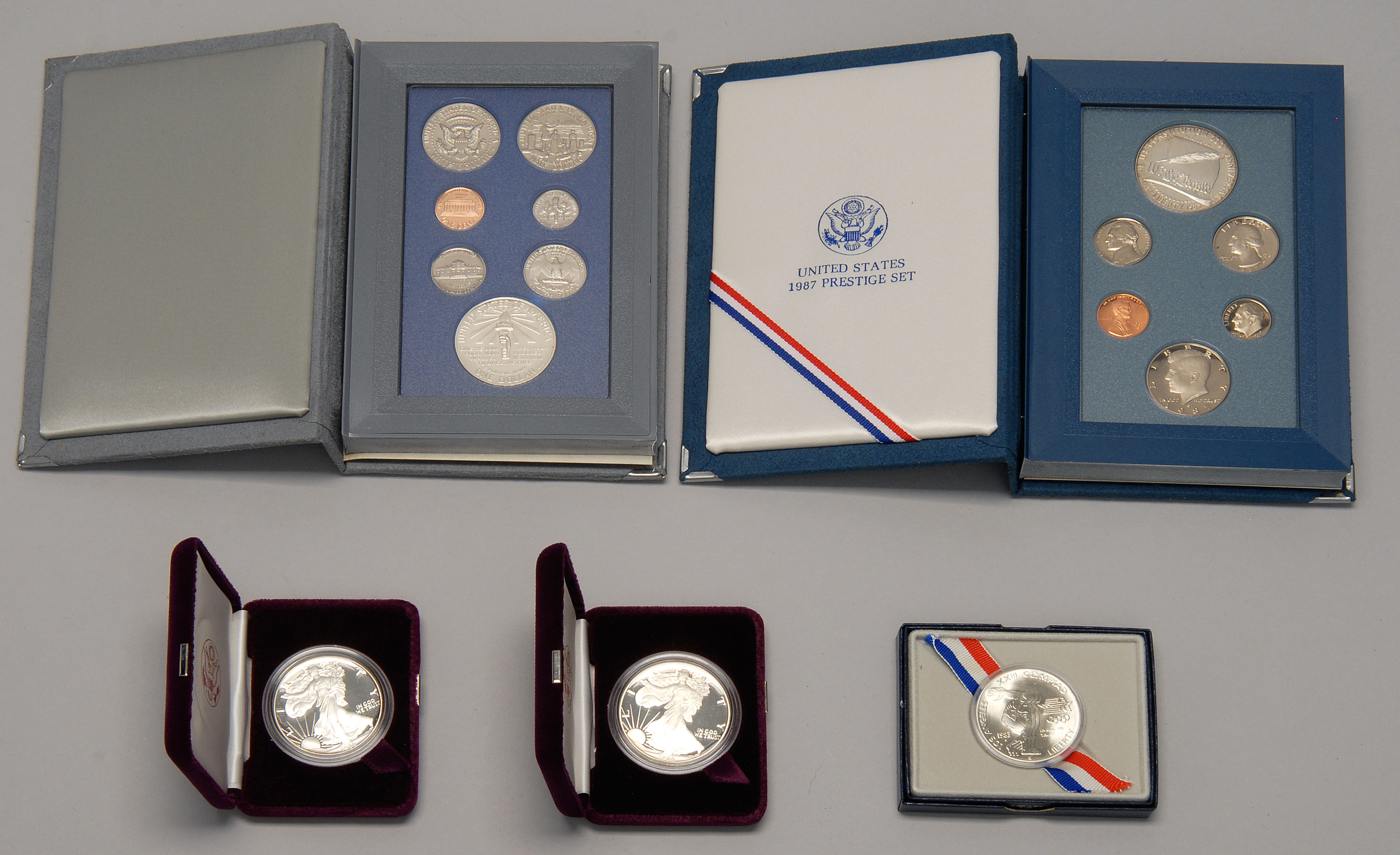 Appraisal: FIVE U S COMMEMORATIVE AND PRESTIGE SETS Two American Eagles