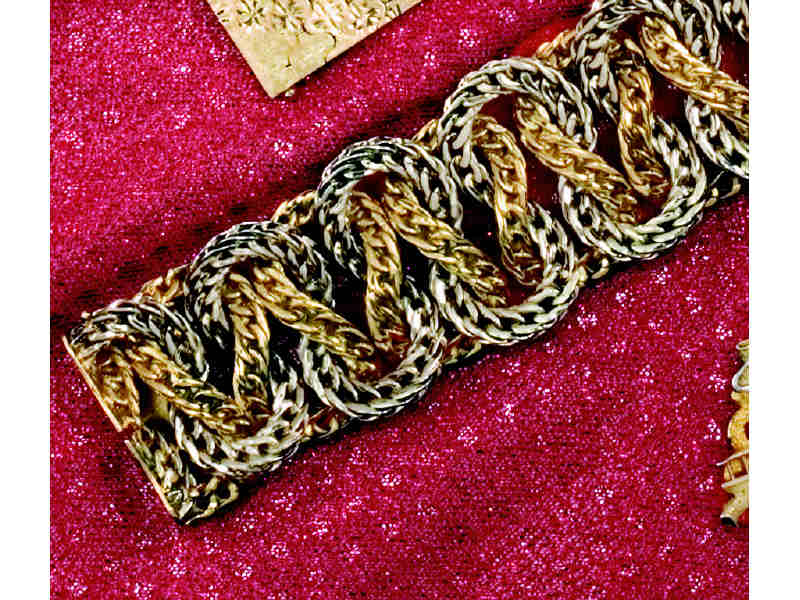 Appraisal: GOLD BRACELET k yellow and white gold interlocking braid design