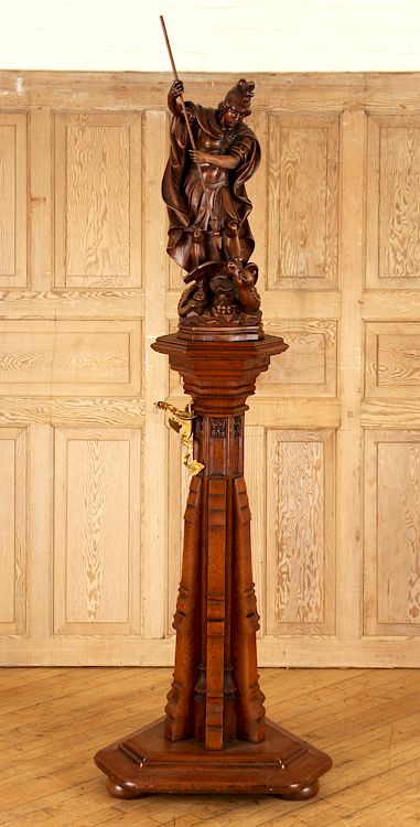 Appraisal: CARVED WOOD FIGURE SAINT GEORGE OAK PEDESTAL A carved wood