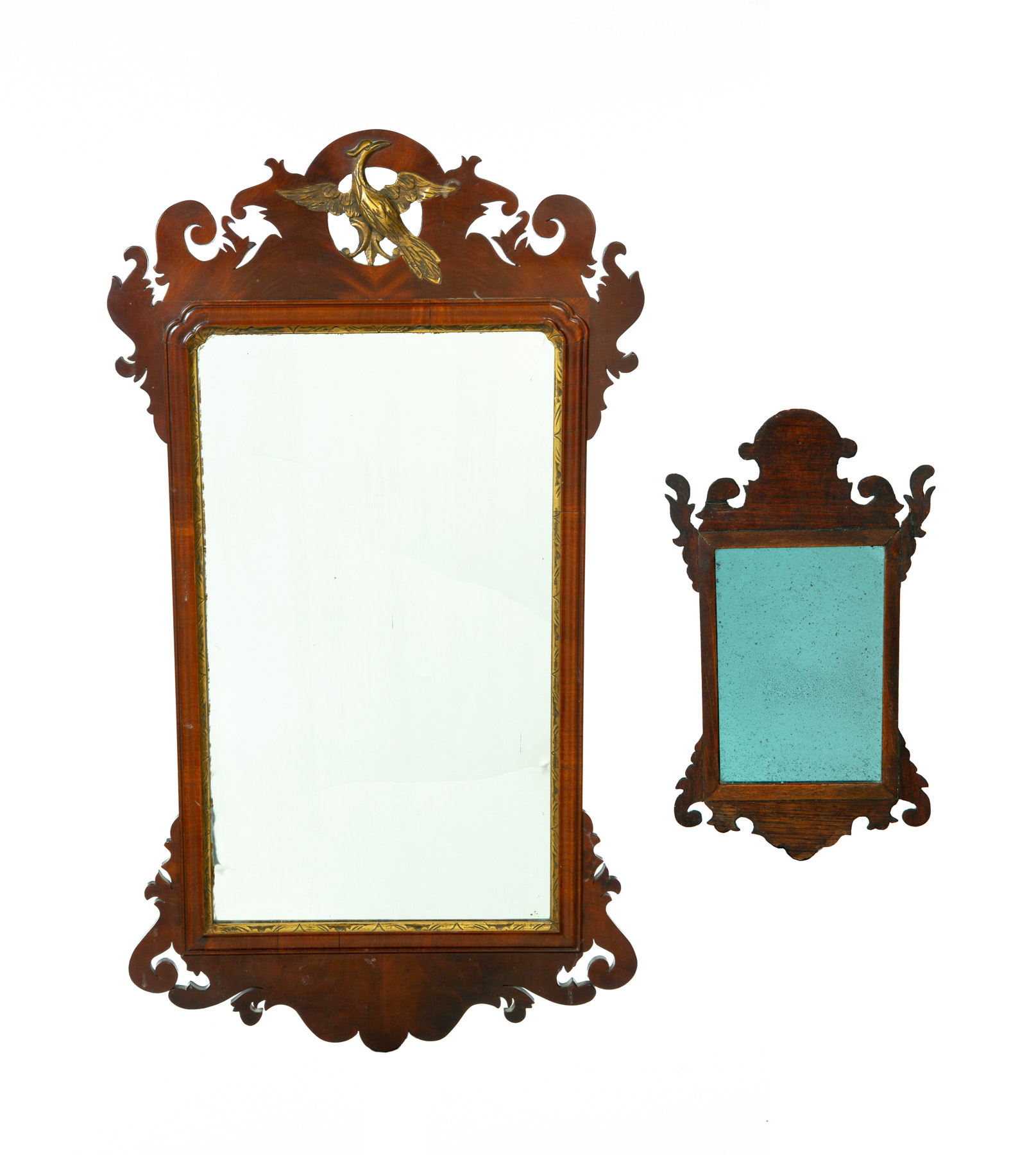 Appraisal: TWO CHIPPENDALE MIRRORS American ca mahogany Scrolled crests and bottoms