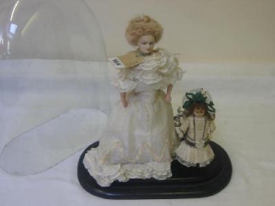 Appraisal: A doll display comprising wax shoulder head doll with fixed