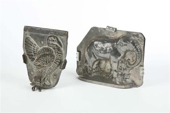 Appraisal: TWO CHOCOLATE MOLDS A tin with metal straps standing elephant