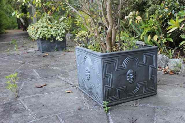 Appraisal: A PAIR OF GEORGIAN STYLE COMPOSITE FAUX LEAD SQUARE PLANTERS