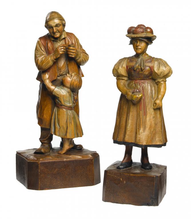 Appraisal: TWO SIMILAR SWISS POLYCHROME MAPLE CARVINGS OF A LADY AND