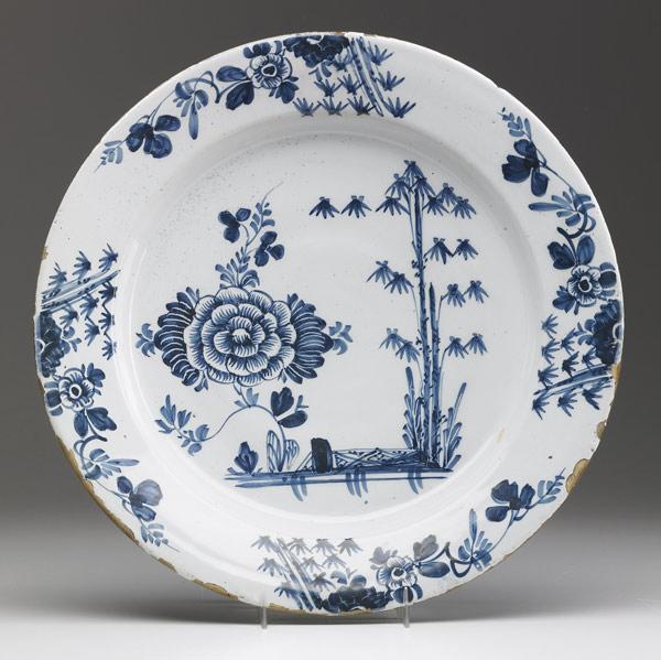 Appraisal: ENGLISH DELFT Charger with floral decoration ca - dia