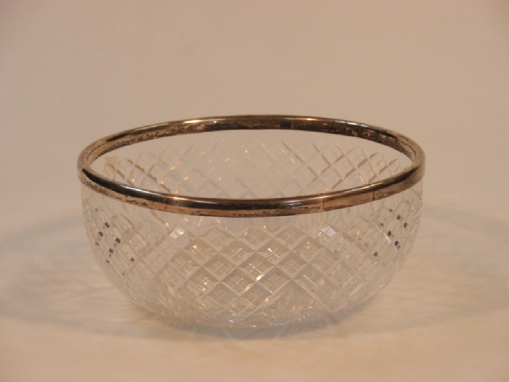 Appraisal: A cut glass fruit bowl with silver collar hallmarked rubbed