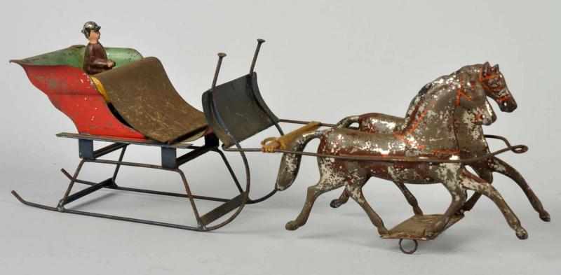 Appraisal: Early Tin Horse-Drawn Sleigh Toy American Pulled by two horses