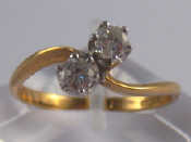 Appraisal: A carat gold two stone diamond ring estimated total diamond