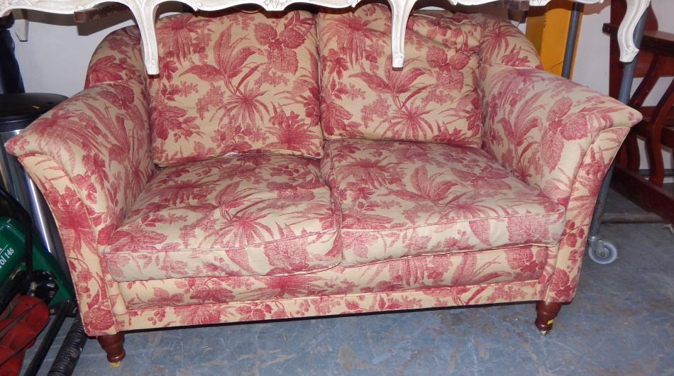 Appraisal: A two seat sofa upholstered in red and gold floral