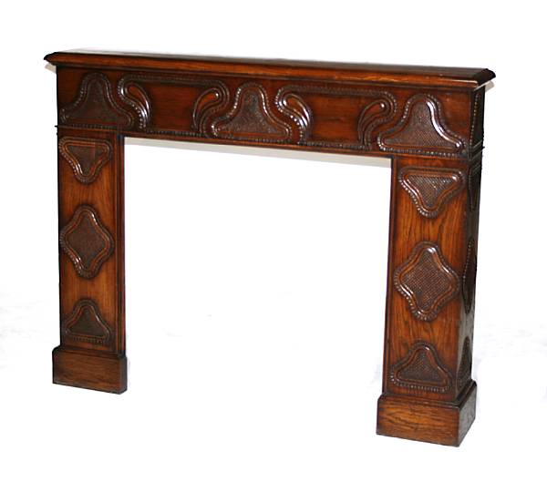 Appraisal: An English Baroque style oak fireplace surround height in width