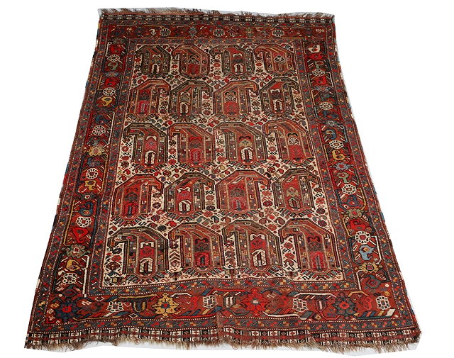 Appraisal: A KHAMSEH POLYCHROME RUG with exaggerated boteh decoration and stylistic