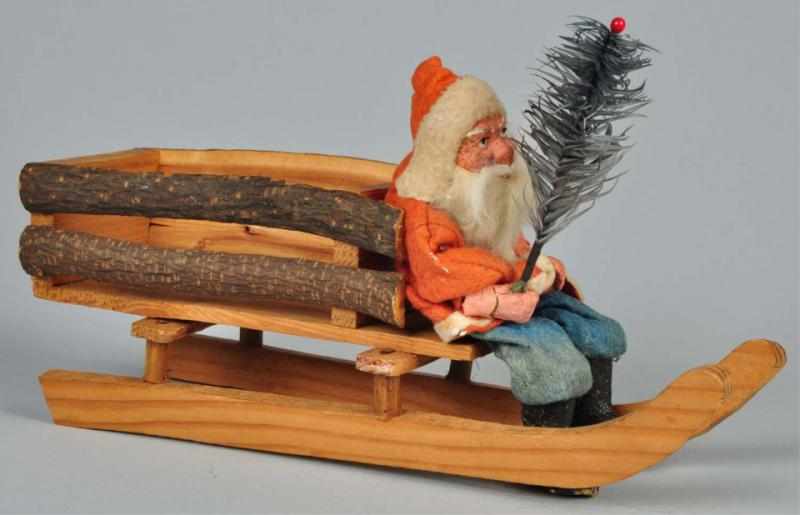 Appraisal: Wooden Santa-Driven Sleigh Description Santa with composition face and hands