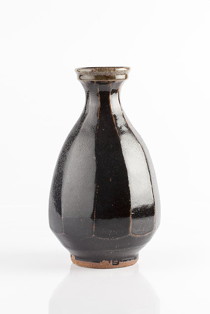 Appraisal: Jim Malone British b Vasetenmoku glaze and faceted sidesimpressed potter's