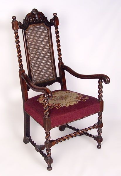 Appraisal: CARVED MAHOGANY CANE BACK ARM CHAIR Spiral stiles legs and