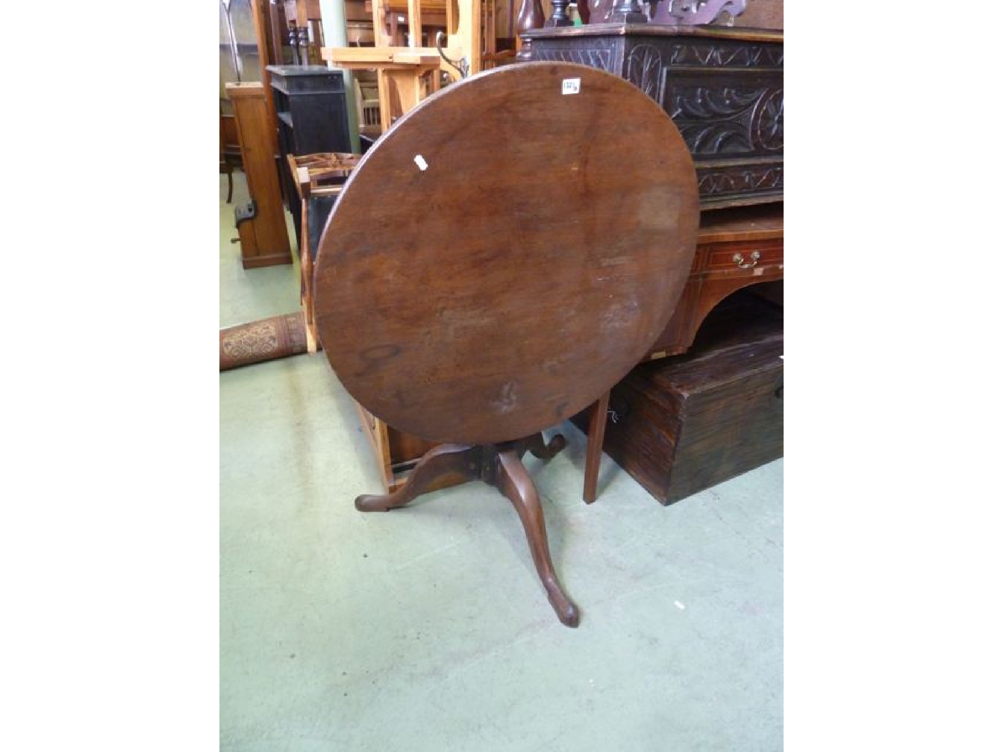 Appraisal: A th century mahogany snap top table on turned pillar